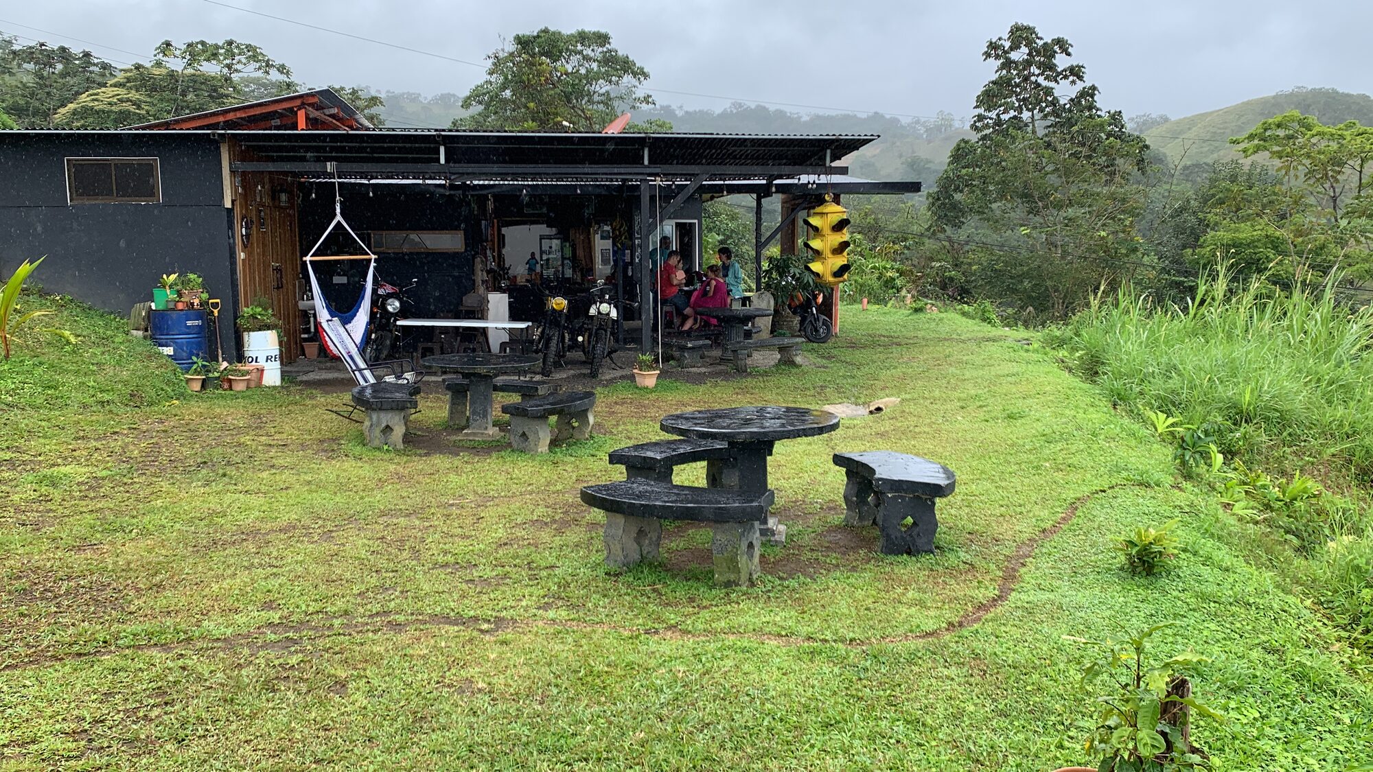 The open-air La Ventanita cafe with picnic tables on the grass