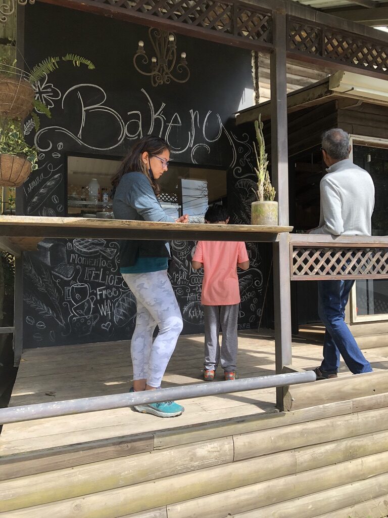 People ordering at the counter of Stella’s bakery