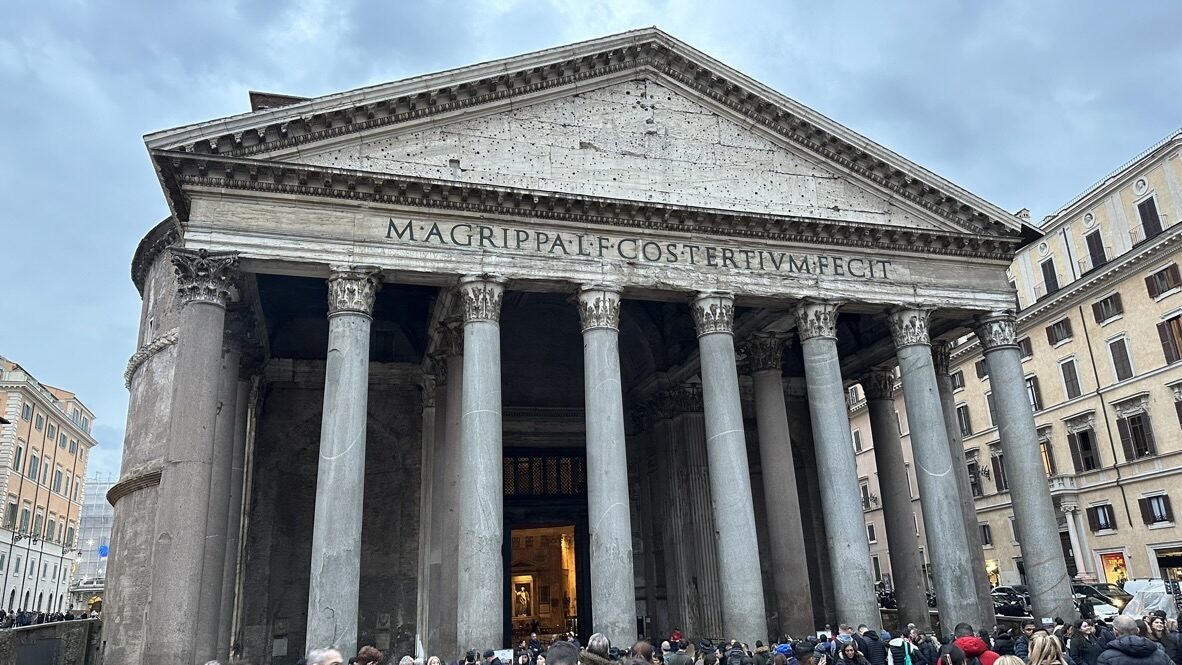 The columned front of the Pantheon under a cloudy sky