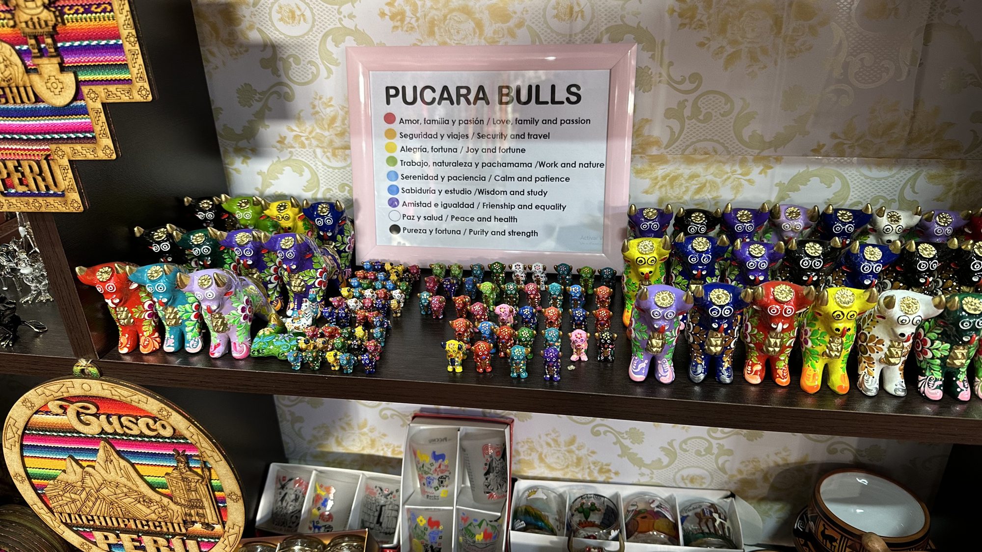 Shelves of brightly painted ceramic Pucará bulls in a shop